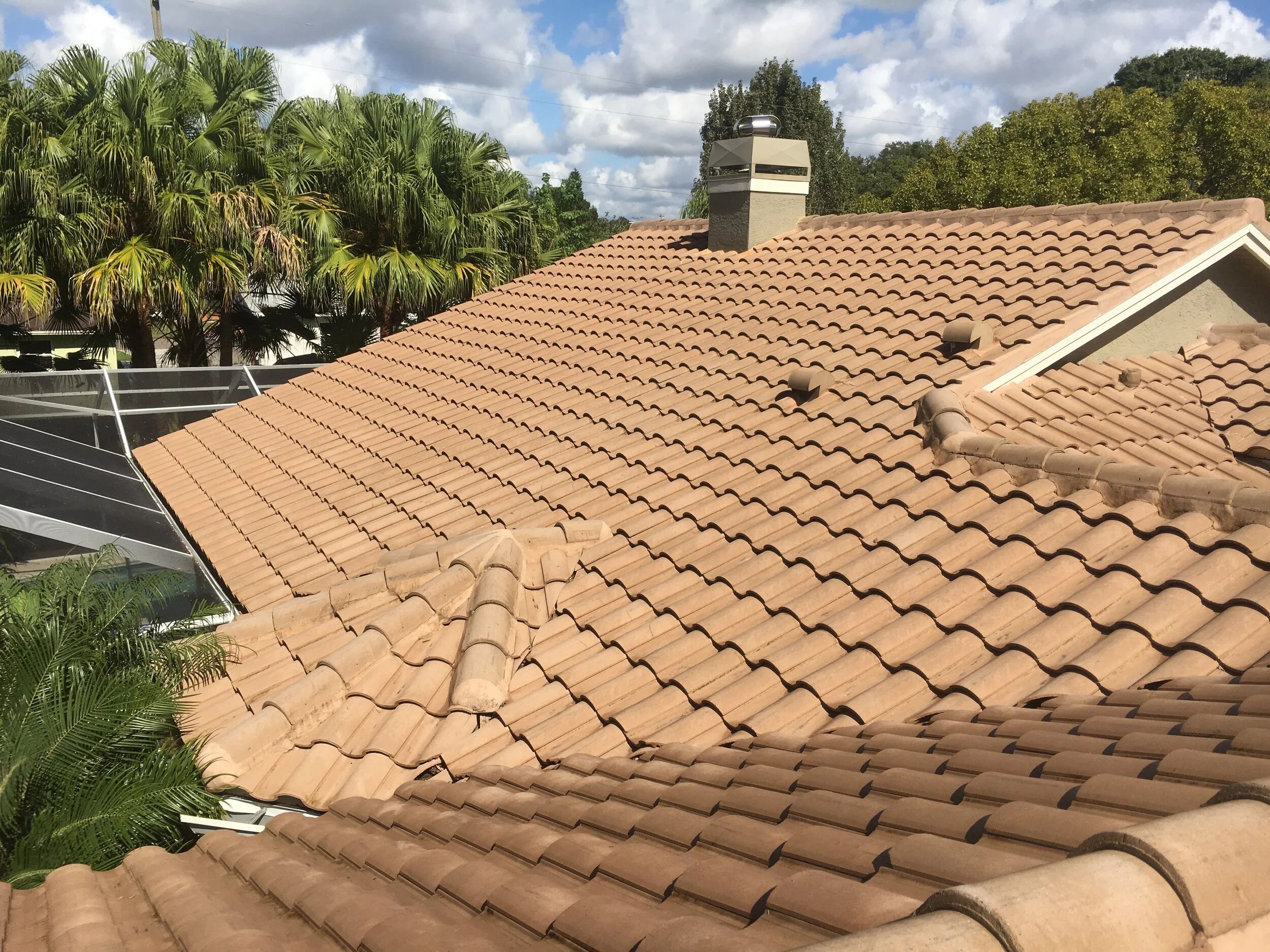 The same barrel tile roof after a soft wash with the tan tile color restored